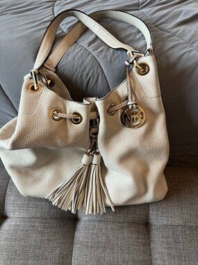 Michael Kors Cream Pebbled Leather Tassel Drawstring Shoulder Bag